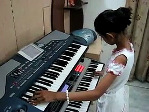 little girl playing old song piano