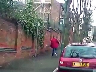 Drunk man tries to walk up the street
