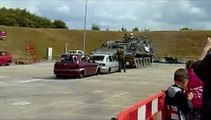 Tank crushes cars