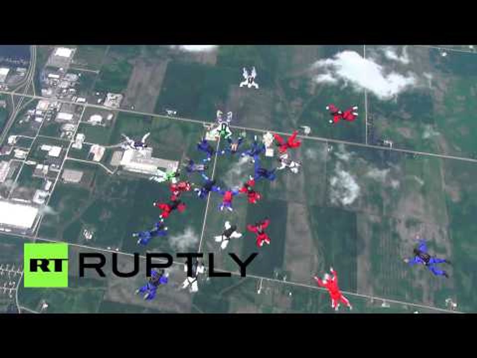 Divine Descent: More than 30 skydivers perform amazing synchronic stunt