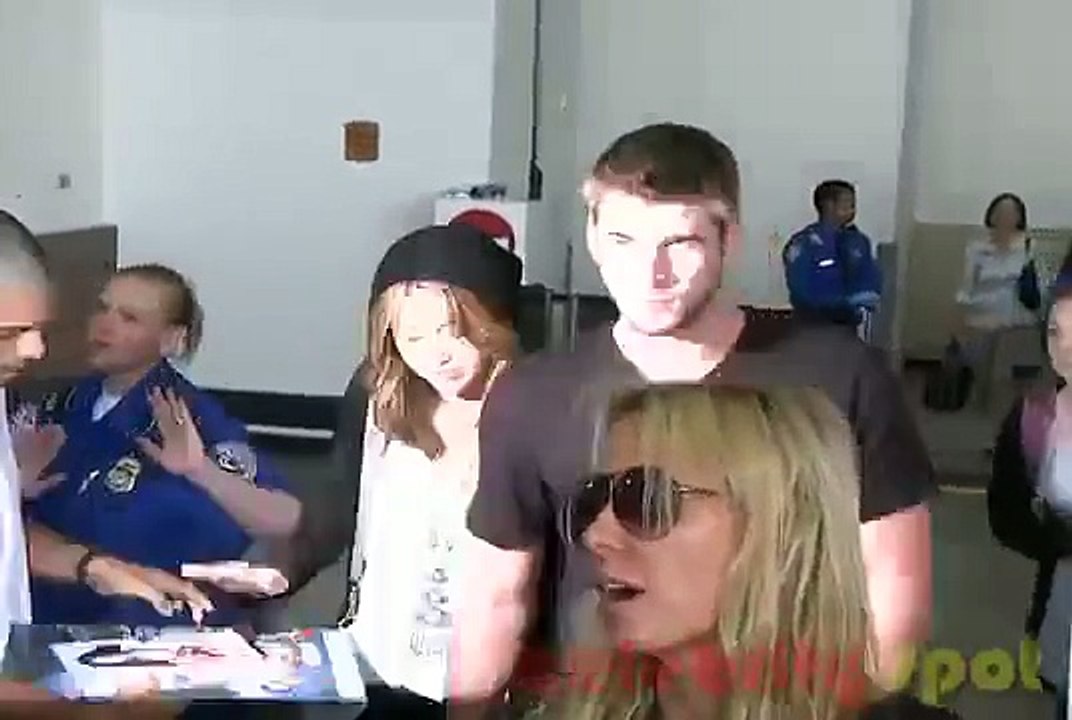 Miley Cyrus Arrives at LAX with Liam Hemsworth