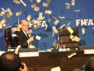 Prankster showers Sepp Blatter in fake bank notes