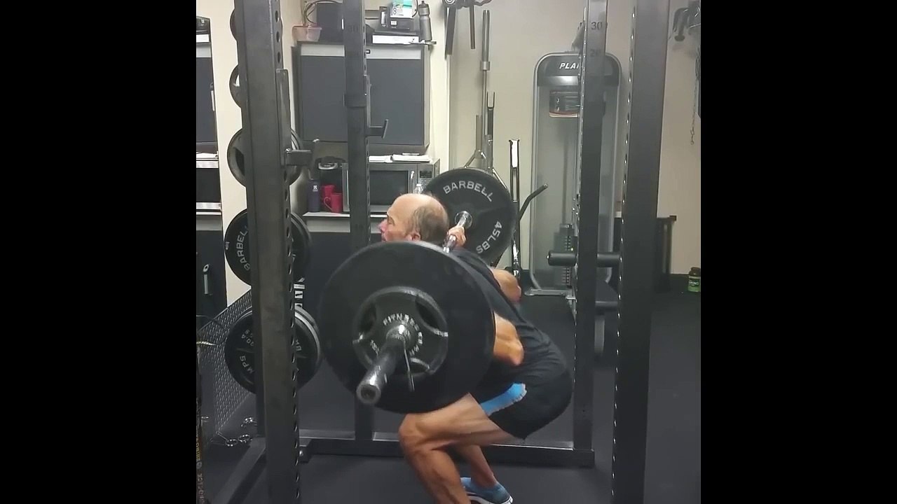 Dr. Mercola Performs An Overhead Squat Exercise