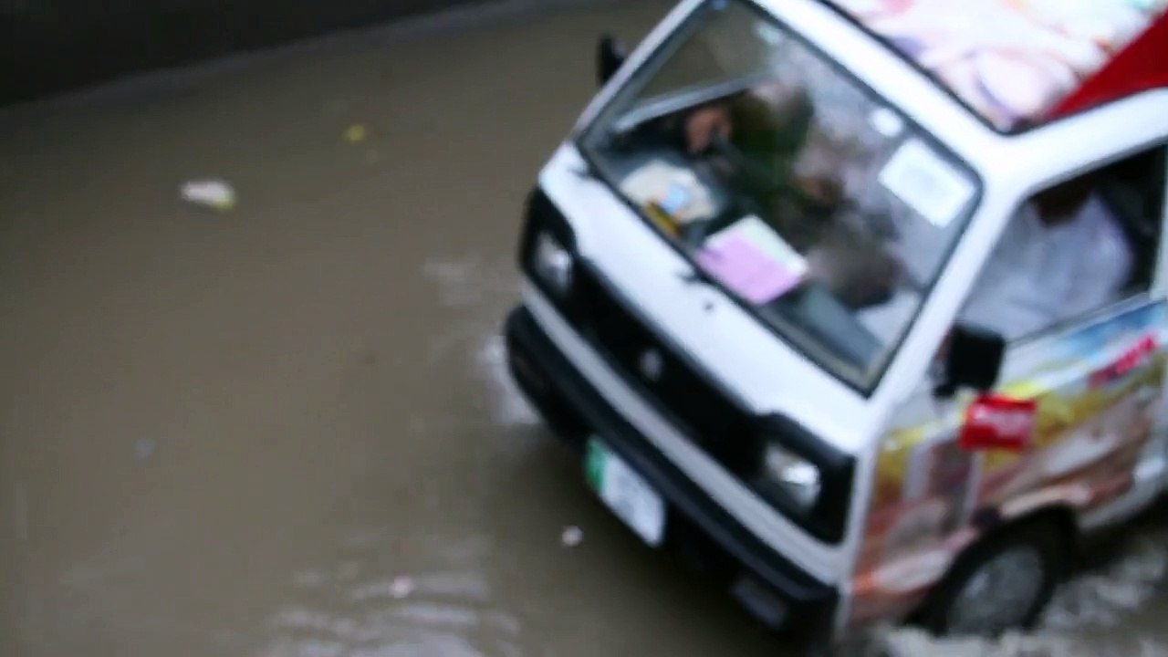 Monsoon in Pakistan Cars, Kids playing in water, Men, women, motorcycles in Rain 21 July 2015 Lahore