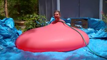 Giant water Balloon explodes with man inside in Slow Motion