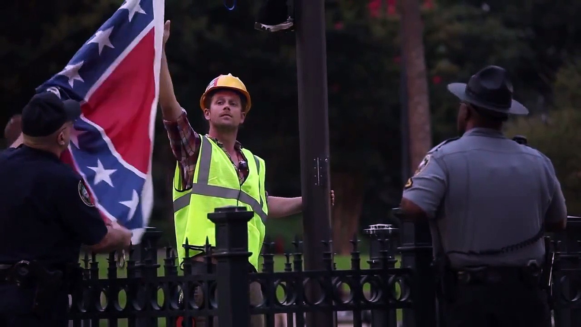 Activist takes down Confederate flag