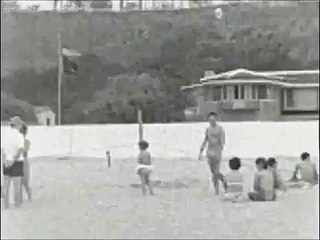 August 19, 1962 - President John F. Kennedy takes a swim at the beach in Santa Monica, CA.