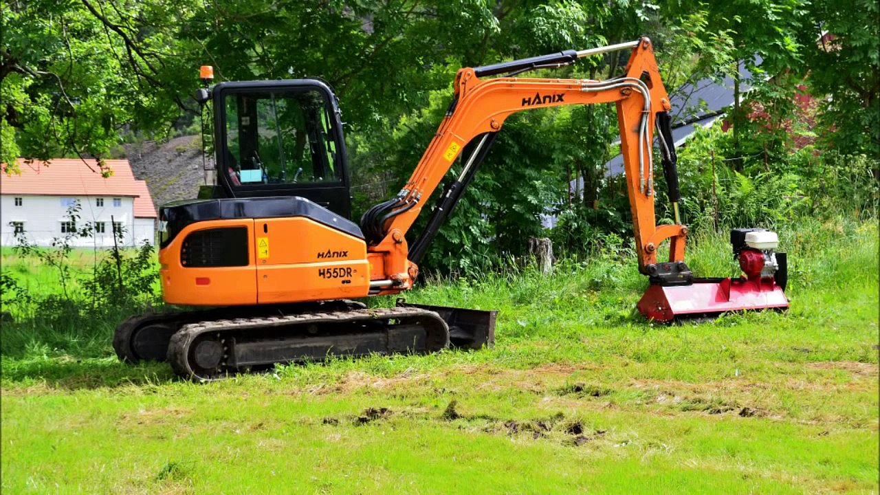 Hanix excavator and a "no name" atv flail mower