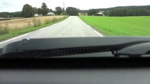 Moose and calf cross road in front of car near Eidsvoll, Norway (moose cross 5: 10 in video)