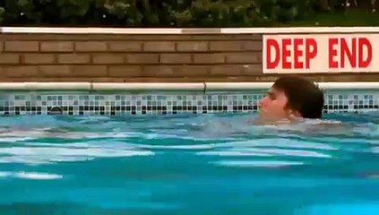 Another business suit in the swimming pool scene