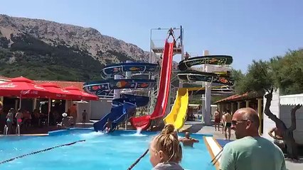Diving face first down a water slide