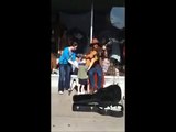 Blind 8-year-old autistic boy stops to listen to street guitar