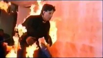 Stunt man in fire jumping off a building