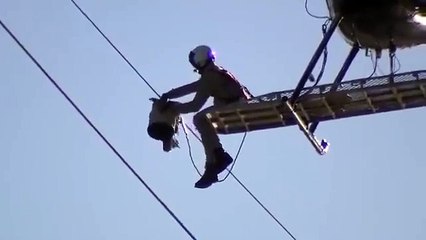 Army man is rescuing a bird after extreme effort