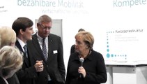IAA 2011: Bundeskanzlerin Angela Merkel im Elektroauto StreetScooter