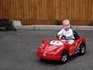 Amazing 7 month old baby driving car