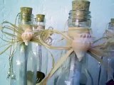 Invitación de boda para playa en botella con pergamino y estrella de mar o caracol