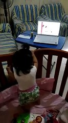 Baby dancing and singing in the crib