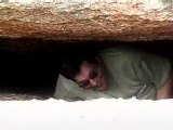 Fat Guy getting stuck in a cave.
