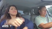 Girl dancing in driving car beside most patient mom ever