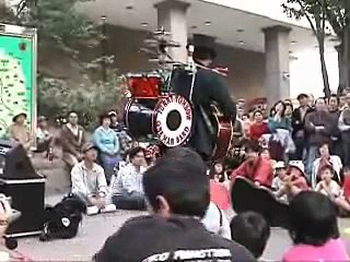 One-Man Band sings "Take Me Home,Country Roads"