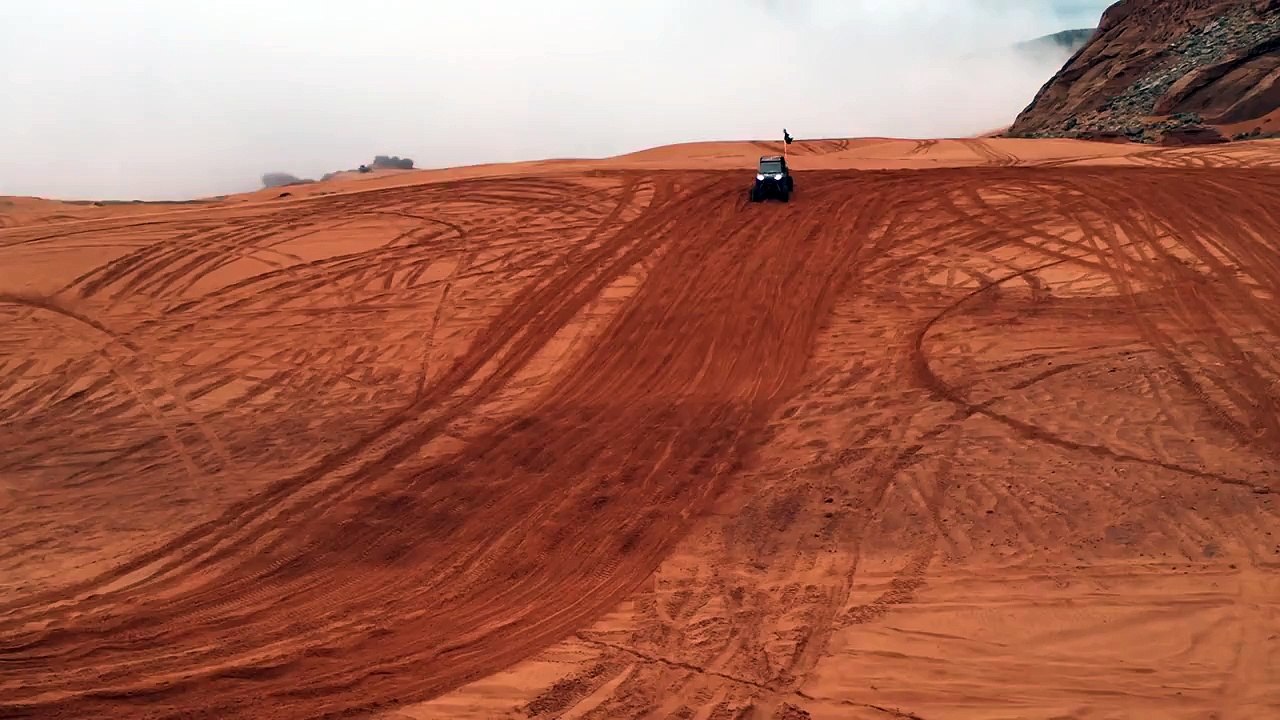 Rzr 1000 huge jump at sand hollow  sand dunes! Crazy!