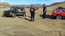 Silly girl attempts mud pit in jeep and on foot