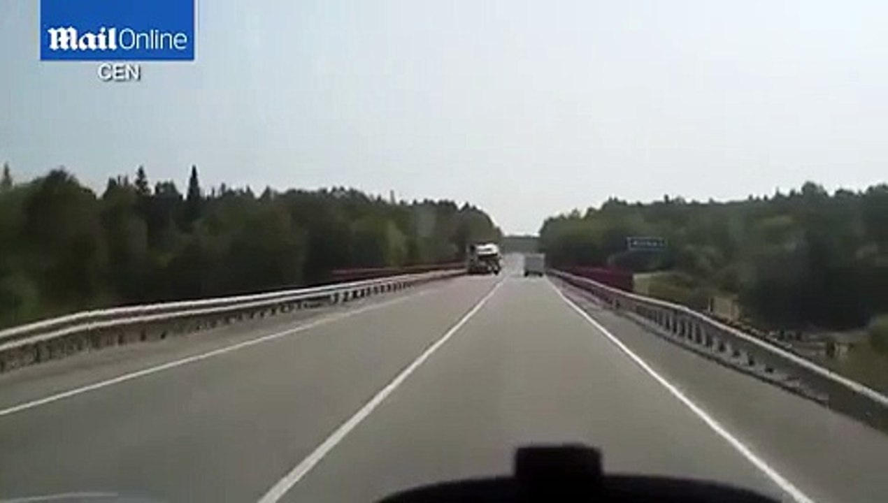 Terrifying moment oncoming lorry tips over