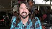 Foo Fighters Dave Grohl Wheels Through LAX With Broken Leg