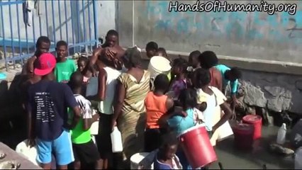 HAITI - Gathering Water in Cite Soleil