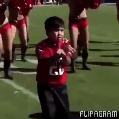 This kid dances better than the cheerleaders