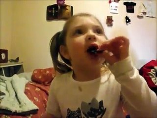 Little girl's first taste of sour pop rocks