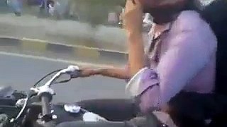 Boy wheeling on Bike with his Girl Friend