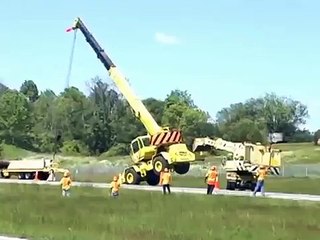 Close call for highway construction crane