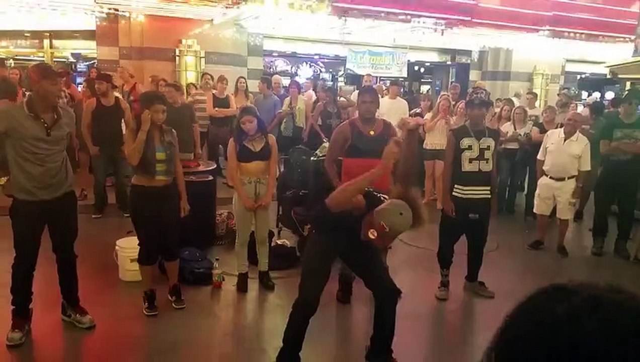 Guy does crazy arms dance at mall