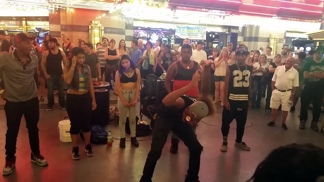 Guy does crazy arms dance at mall