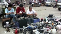 Men selling mobile phones at a second hand market in China. Stock Footage