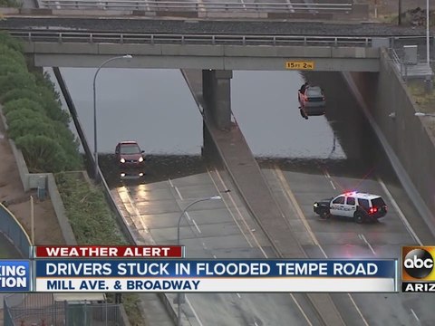 Drivers stuck in flooded road in Tempe