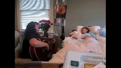Une mère chante pour sa fille mourante.