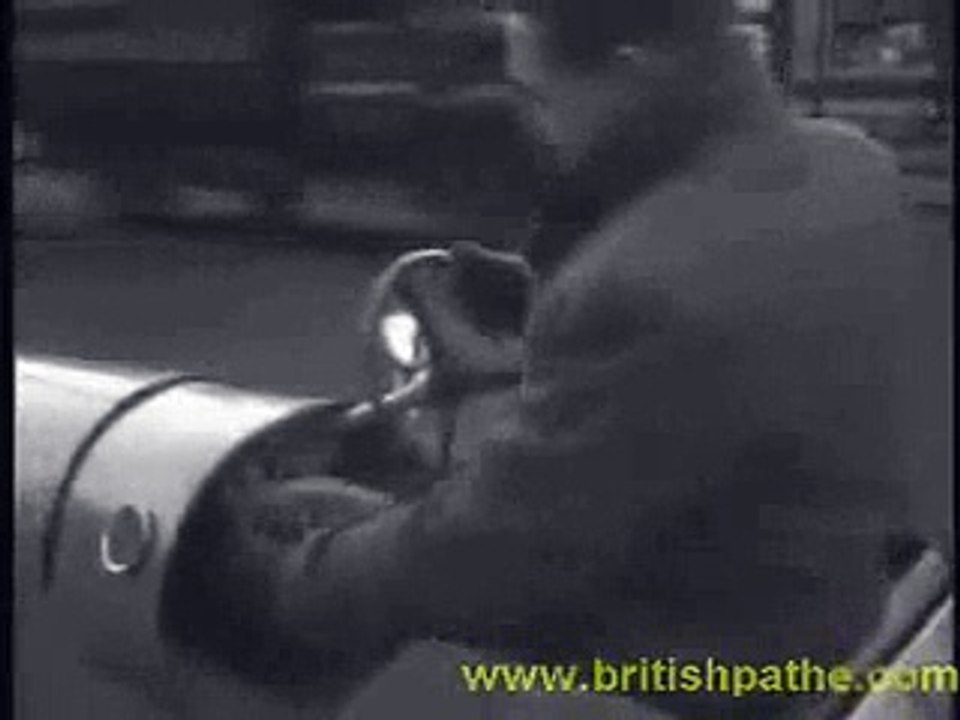 Kenneth Smee drives his home-made electric car (1948)