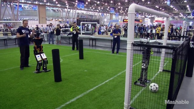 Robots playing soccer at RoboCup 2015 is like watching toddlers learn to kick