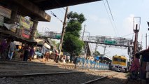 Dangerously railway crossing at a open rail gate