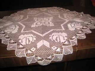 Table clothes bed covers and clothes for baby all made by hand