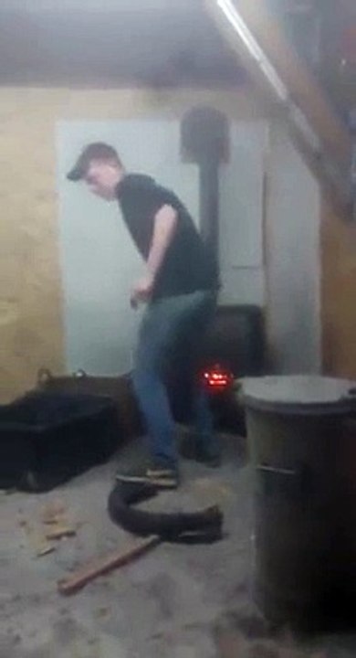 Dumb guy explodes Aerosol Can in a Wood Stove