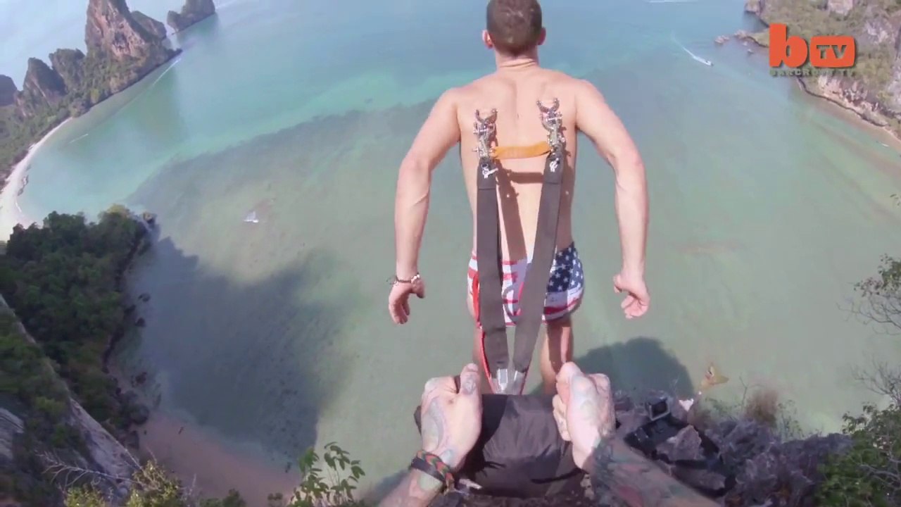 Base Jump : Il saute avec un parachute fixé à sa peau - Vidéo Dailymotion