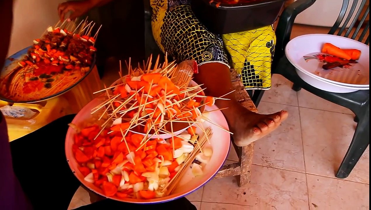 Impromptu song and dance by Sierra Leone woman preparing food for wedding in Gambia