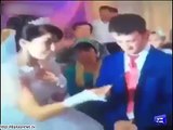 Outrage at bride's joke, groom kicks table.