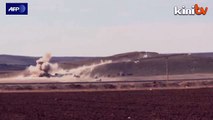 Shells hit peshmerga fighters in the besieged Kobane