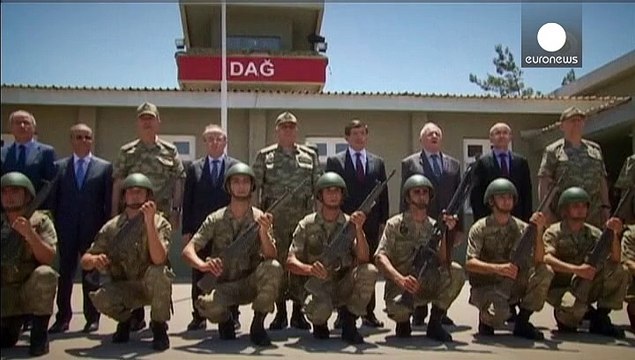 Turkish PM visits ISIL-hit border region as police clash with PKK supporters
