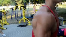 Training arms and shoulders. Bodybuilding. Mens Physique
